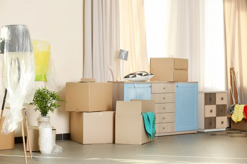 Loading furniture into a removal van during a booked moving service