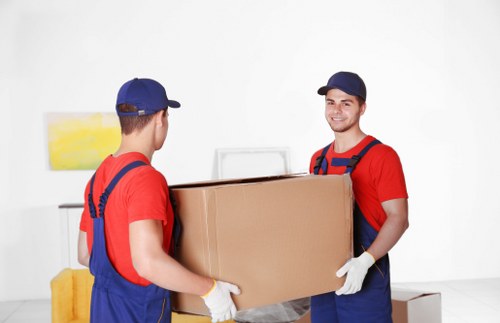 Careful furniture transport through a residential property in Archway