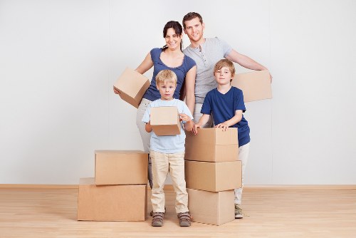 Packed boxes and furniture ready for a move from an Archway property