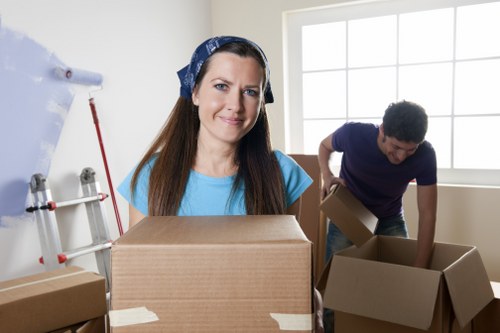Professional movers loading household items for an Archway relocation