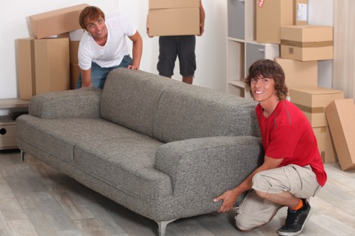 Packing boxes and preparing for a moving van service in Archway