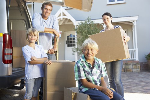 Packed moving boxes and furniture ready for house removals in Archway