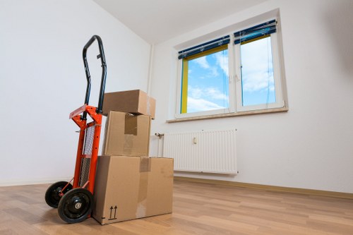 Local office relocation team handling desks and equipment in Archway