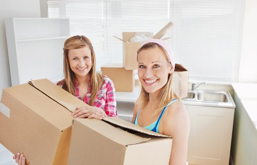 Business staff preparing files and office items for relocation in Archway